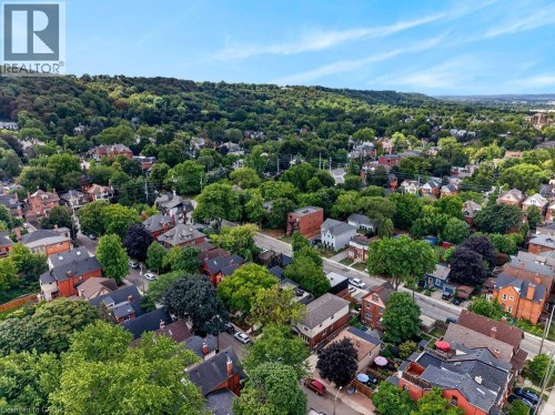 Neighborhood featuring established homes, mature tree canopy, and distant elevated terrain - 16 Bruce Street, Hamilton, ON 
