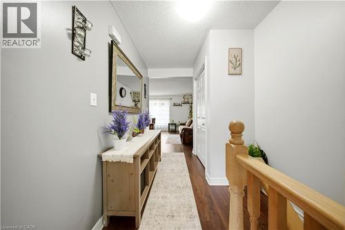 Wood-finish flooring, light grey wall paint, and white trim - 384 Limeridge Road E Unit# 16, Hamilton, ON 
