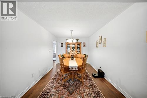 Hardwood-finish flooring, white painted walls, and a built-in display cabinet - 384 Limeridge Road E Unit# 16, Hamilton, ON 