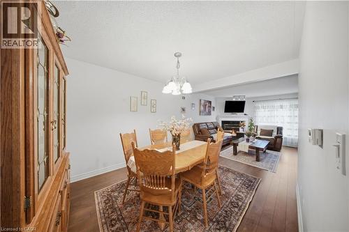 Wood-finish flooring throughout, white wall finishes, and recessed lighting - 384 Limeridge Road E Unit# 16, Hamilton, ON 