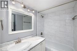 White vanity with a marble-finish countertop and undermount sink - 