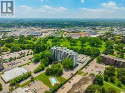 High-rise building with multiple balconies, an outdoor swimming pool, and dedicated parking areas - 