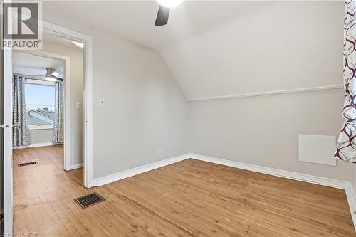 Wood-finish flooring with white trim - 160 Lorne Crescent, Kitchener, ON 
