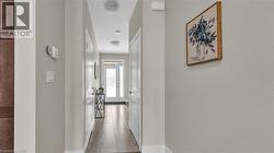 Entryway featuring light neutral wall paint, recessed lighting, and wood-finish flooring - 