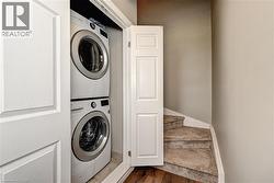 Stackable washer and dryer appliances, bi-fold closet doors, and carpeted stairs - 