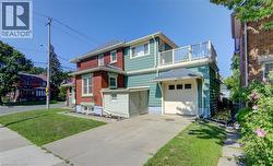 Cement driveway to garage with inside entry.  Extra storage beside driveway. - 