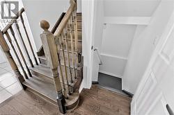 Hardwood staircase with turned balusters and carved newel posts - 