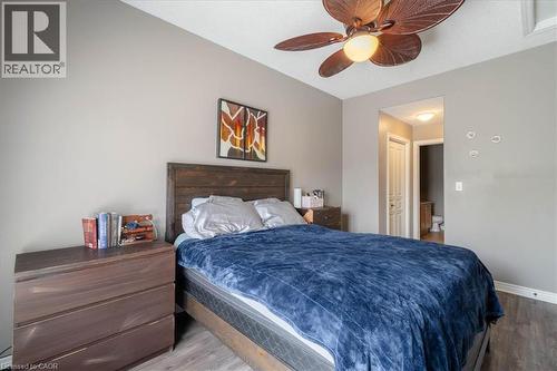 Main Floor Primary Bedroom with en suite bathroom and his and hers closet - 20 Millcroft Drive, Simcoe, ON 