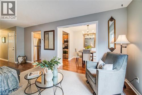 Hardwood-style flooring, stainless steel appliances, recessed lighting, and a chandelier in the dining area - 360 Cornridge Place Unit# 2, Waterloo, ON 