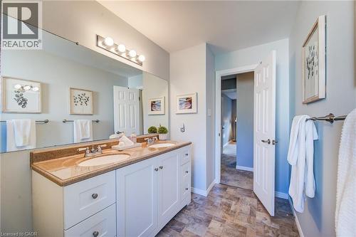 Dual vanity with undermount sinks, speckled countertop, and white cabinetry - 360 Cornridge Place Unit# 2, Waterloo, ON 