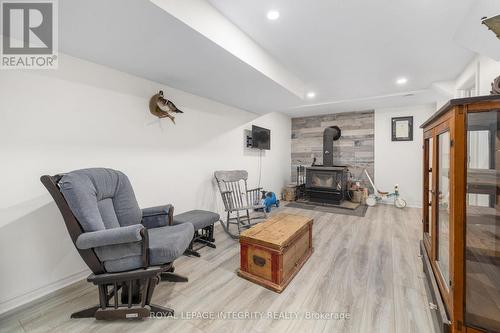 Lower Level Sitting Room w/ Wood Burning Fireplace - 4228 O'Neil Road, Ottawa, ON 