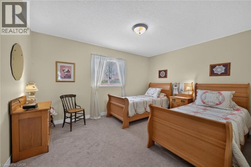 Neutral-toned walls and ceiling with a flush-mount light fixture - 10 Balvenie Boulevard, Caledonia, ON 