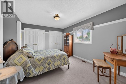 Neutral-toned carpeting with light gray walls and white trim - 10 Balvenie Boulevard, Caledonia, ON 