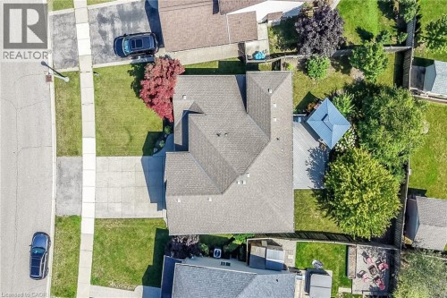 Pitched roofline, concrete driveway, mature trees, rear deck, and backyard gazebo - 10 Balvenie Boulevard, Caledonia, ON 