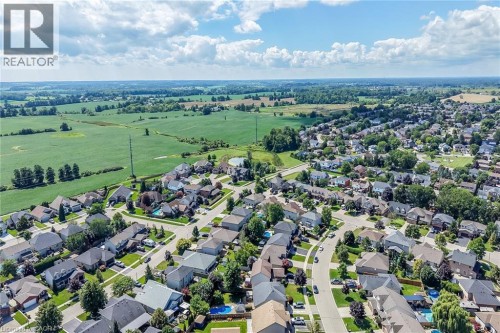 Residential neighborhood with a mix of single-family homes, mature trees, and paved streets - 10 Balvenie Boulevard, Caledonia, ON 