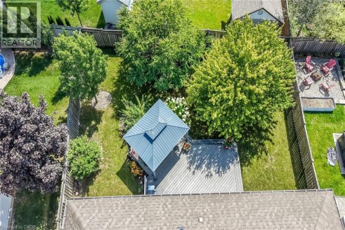 Expansive backyard featuring a large deck, gazebo with a metal roof, and established trees - 10 Balvenie Boulevard, Caledonia, ON 