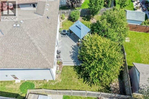 Expansive backyard featuring a composite deck, metal gazebo, and mature landscaping - 10 Balvenie Boulevard, Caledonia, ON 