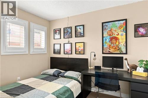 Two windows featuring white plantation shutters - 187 Eden Oak Trail, Kitchener, ON 