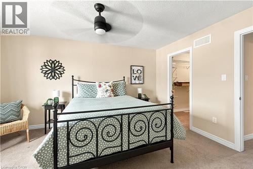 Recessed lighting, ceiling fan fixture, neutral wall paint, carpet flooring, and an open doorway leading to a closet with shelving - 187 Eden Oak Trail, Kitchener, ON 