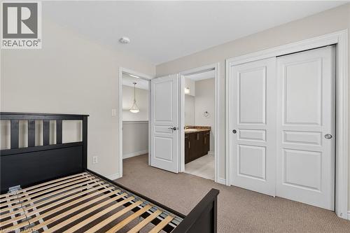 Neutral-toned walls complement the carpeted flooring - 9 Winterberry Boulevard, Thorold, ON 