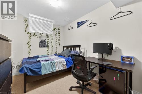 Carpeted flooring, recessed ceiling lighting, baseboard heating, and window with blinds - 9 Winterberry Boulevard, Thorold, ON 