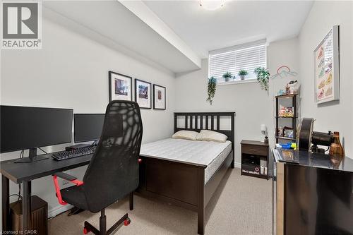 Recessed ceiling lighting, a built-in window with blinds, and light-toned carpeting enhance this room - 9 Winterberry Boulevard, Thorold, ON 