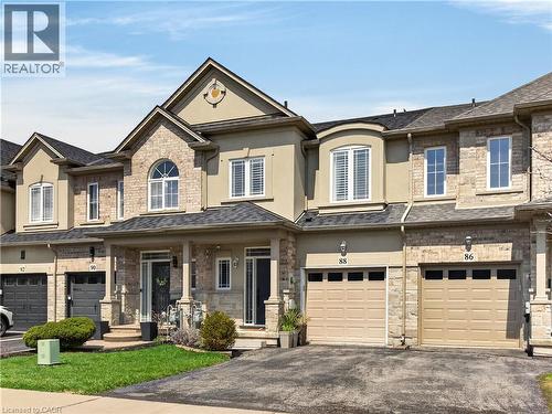 Stone and stucco exterior with multiple gables - 88 Highgate Drive, Hamilton, ON 
