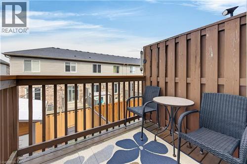 Private balcony with wood railing and privacy fence - 88 Highgate Drive, Hamilton, ON 