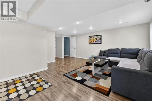 Recessed lighting, wood-finish flooring, white trim, and white interior doors - 88 Highgate Drive, Hamilton, ON 