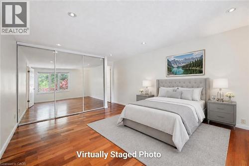 Wood-finish flooring throughout, complemented by recessed lighting - 345 Beechlawn Drive, Waterloo, ON 