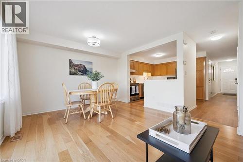Hardwood flooring throughout, recessed lighting, and a kitchen with wood cabinetry - 151 Clairfields Drive Unit# 3, Guelph, ON 