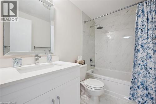 White vanity with an integrated sink and chrome faucet - 151 Clairfields Drive Unit# 3, Guelph, ON 