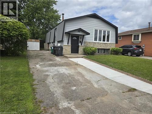Split-level residence featuring gray siding and stone veneer accents - 99 Cluthe Crescent, Kitchener, ON 