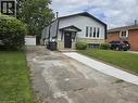 Split-level residence featuring gray siding and stone veneer accents - 99 Cluthe Crescent, Kitchener, ON 