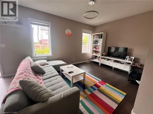 Recessed lighting, wood-finish flooring, and multiple windows - 298 Buttonbush Street, Waterloo, ON 