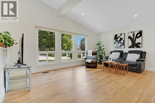Vaulted ceiling, recessed lighting, wood-finish flooring, large windows, and crown molding - 196 Abraham Street, Cambridge, ON 