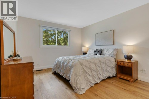 Light wood-finish flooring with neutral wall tones - 196 Abraham Street, Cambridge, ON 