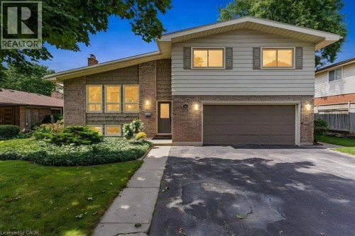 Brick and horizontal siding exterior with a pitched roofline - 196 Abraham Street, Cambridge, ON 