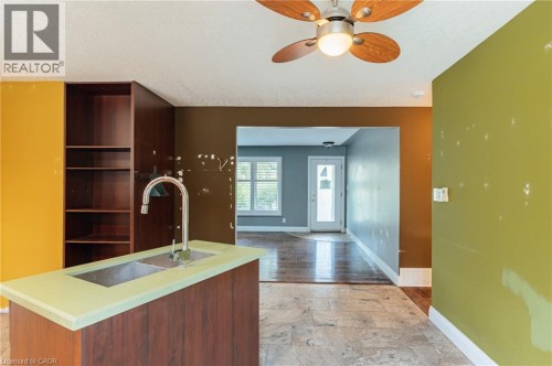 Kitchen island with double basin stainless steel sink and gooseneck faucet - 229 Winfield Avenue, Waterloo, ON 