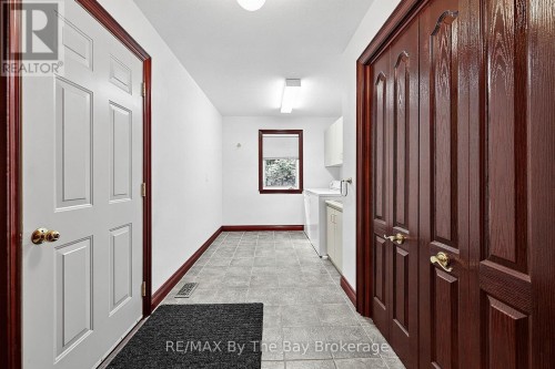 Main Floor Laundry Room with Garage Entry - 90 Goldfinch Crescent, Tiny, ON 