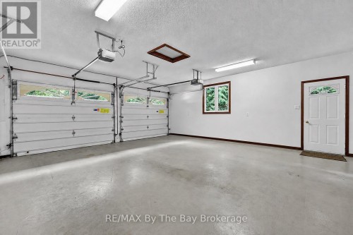 Garage with Side Door - 90 Goldfinch Crescent, Tiny, ON 