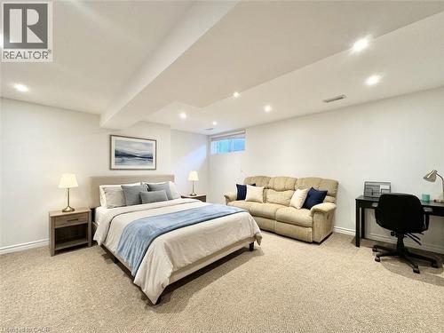 Staged with AI. Basement can be easily used as a bedroom. It comes with the half washroom as well. - 1335 Countrystone Drive, Kitchener, ON 