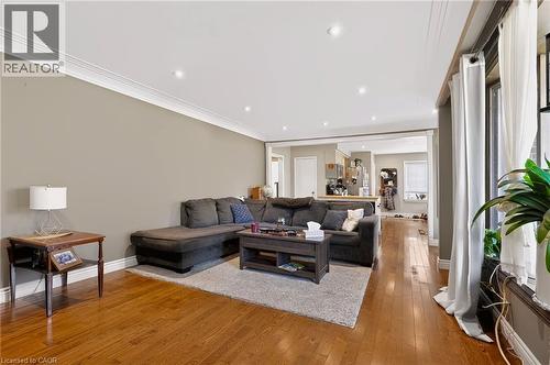 Recessed lighting illuminates wood-finish flooring - 1046 Shepherds Drive, Burlington, ON 