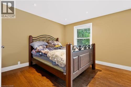 Hardwood flooring, recessed lighting, white trim, and a window with white blinds - 1046 Shepherds Drive, Burlington, ON 
