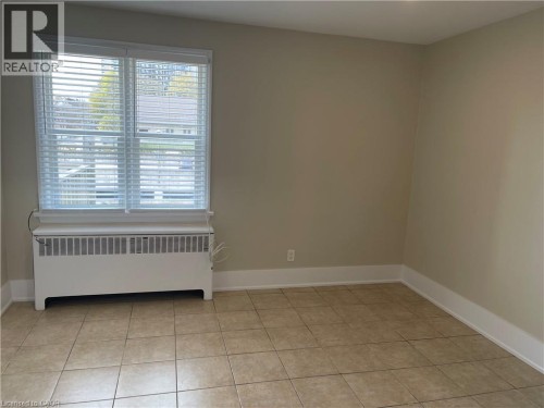 Tile flooring and neutral wall tones - 181 King Street E Unit# 14, Kitchener, ON 