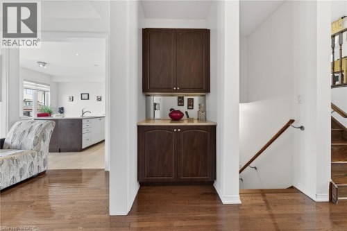 Corridor featuring dark wood-style flooring - 97 Sirente Drive, Hamilton, ON 