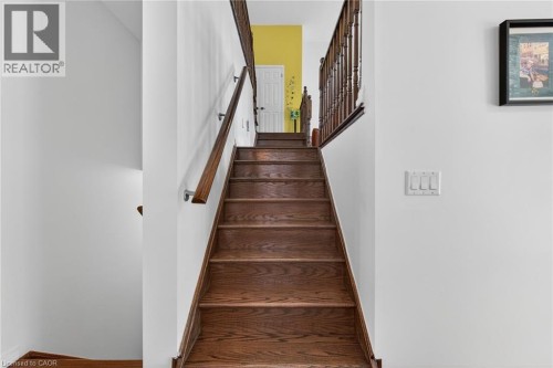 Staircase featuring wood finished floors - 97 Sirente Drive, Hamilton, ON 