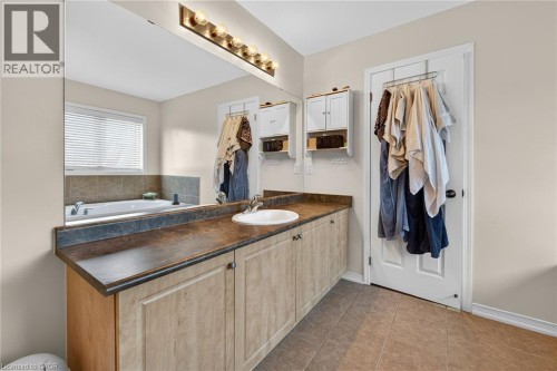 Full bath with vanity and tile patterned flooring - 97 Sirente Drive, Hamilton, ON 