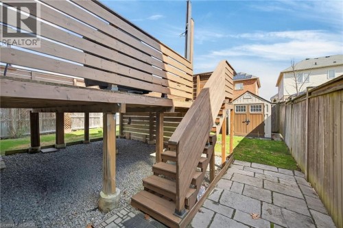Fenced backyard with a storage shed and a patio - 97 Sirente Drive, Hamilton, ON 