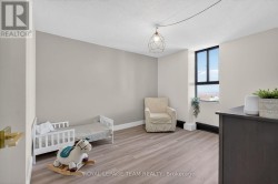 Bedroom w/laminate floors. - 